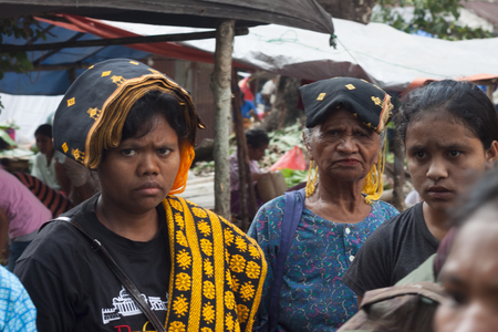 FLORES ISLAND, INDONESIA, 2012-04-18: portrait of old and youg women at the local street marketのeditorial素材