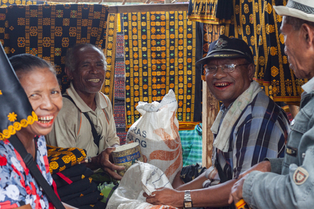 FLORES ISLAND, INDONESIA, 2012-04-18: old people laughing at their street stall at the local marketのeditorial素材