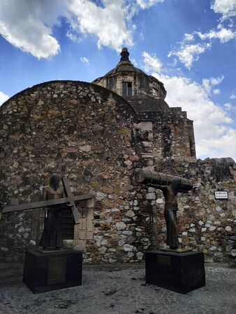 TAXCO, MEXICO, 20 MARCH 2019:  statues with Christian artifacts in front of temple in downtown of Taxcoのeditorial素材