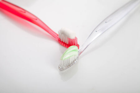 tooth brush in glass  on white backgroundの写真素材