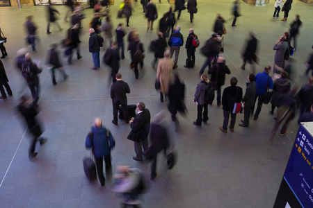 London Train Tube station Blur people movement in rush hour, at King Cross Stationのeditorial素材