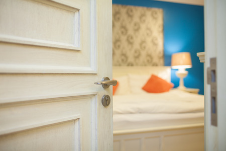 half-open door of a bedroomの写真素材
