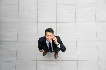 Asian young & success businessman from top view, high angleの写真素材