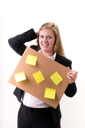 Busy Businesswoman with schedule boardの写真素材
