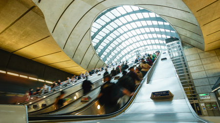 Canary wharf train tube station, London in rush hourのeditorial素材