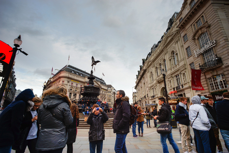 LONDON - FEB 24: One of the most famous tourist destination, Piccadilly Circus, in London. The big advertising screen have become a major attraction of London.のeditorial素材