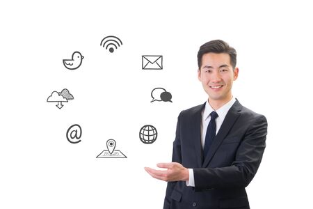 Young businessman showing social media & Internet icon conceptの写真素材