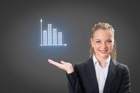 Success businesswoman showing business icon and chartの写真素材