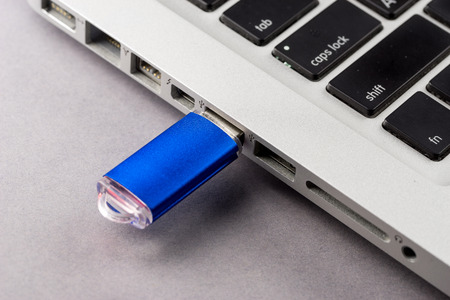 USB Flash drive on computer laptop keyboard