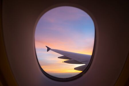 Sunset sky from the airplane windowの写真素材