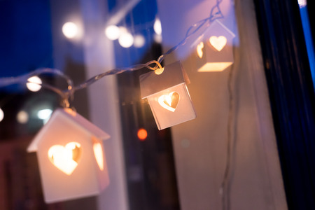 Wood home model with lighting, house conceptの写真素材