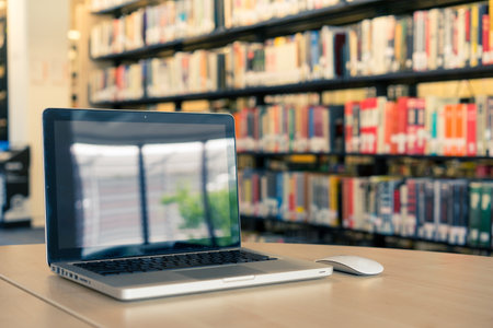 Laptop blank screen in the library and officeの写真素材