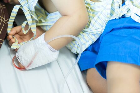 Asian baby in the hospital with saline intravenousの写真素材