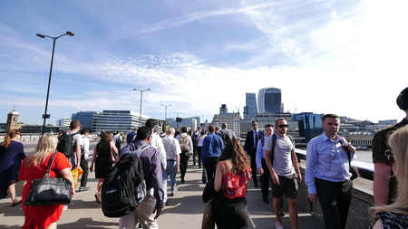 London Bridge, London - 10 June 2017 - Rush hour, businessman walking on London Bridge in the morning in summer. There are a number of offices nearby that area.のeditorial素材