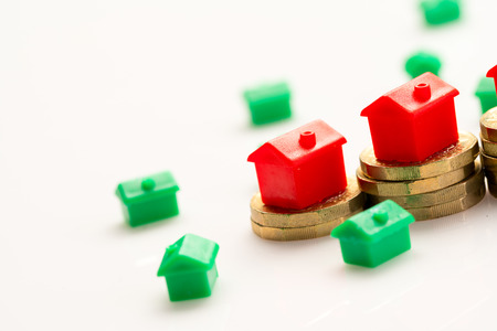 Housing estate concept with coins in studioの写真素材