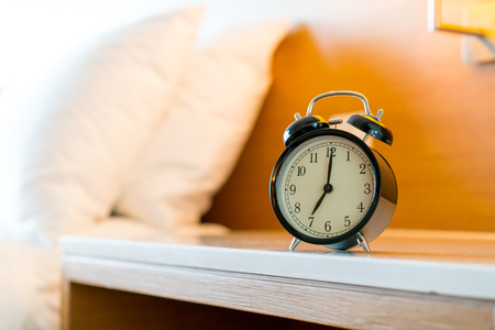 Metal Alarm clock on white bedroom