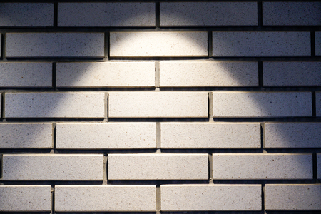 Brick wall with a lamp backgroundの写真素材