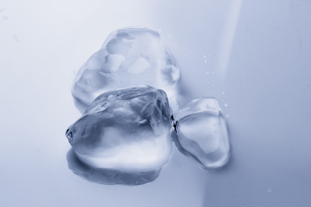 Ice cube melts in studio: Global warming concept