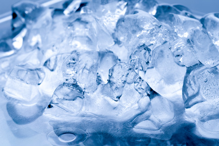 Ice melts in studio, global warming conceptの写真素材