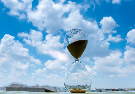 Sand clock with sky and cloud business conceptの写真素材