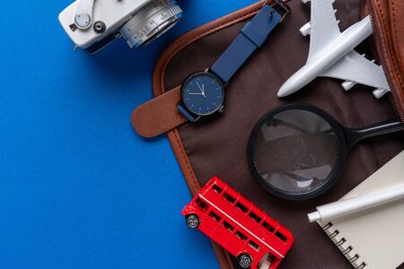 Top view of travel concept still life photography on blue backgroundの写真素材