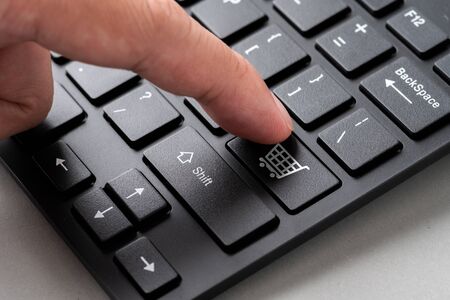 Business, marketing & online shopping strategy concept icon on the cube & computer keyboard