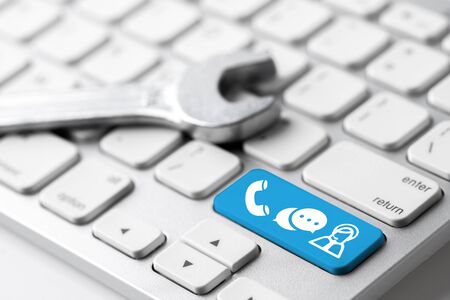 Contact us icon on keyboard with headphone & microphoneの写真素材