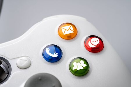 Contact us icon on colorful game controllerの写真素材