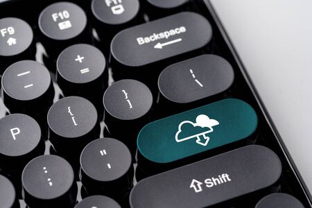 Cloud technology icon for online shopping global business concept on retro keyboardの写真素材