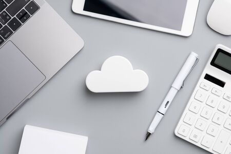 Cloud technology icon for global business concept on a desk from top viewの写真素材