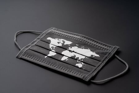 The surgery mask with world map icon for epidemic concept & COVID 19 virusの写真素材