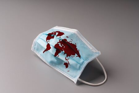 The surgery mask with world map icon for epidemic concept & COVID 19 virusの写真素材