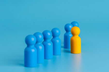 Business & HR global wood puzzle concept for leadership and team with peg doll
