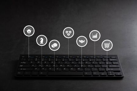 Online shopping & Social media icon on keyboard for global conceptの写真素材