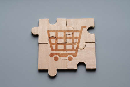 Online shopping icon on wood puzzleの写真素材