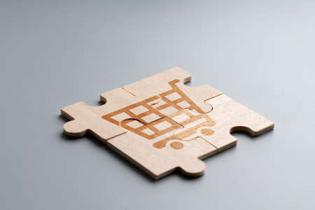 Online shopping icon on wood puzzleの写真素材