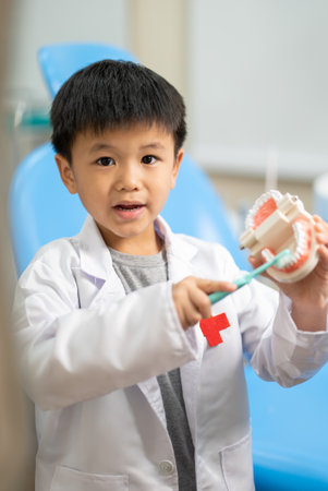 Asian kid check up with dentist at the dental clinic. Concept of dental check up and healthcareの写真素材