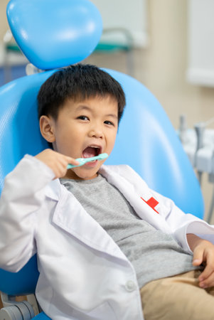 Asian kid check up with dentist at the dental clinic. Concept of dental check up and healthcareの写真素材