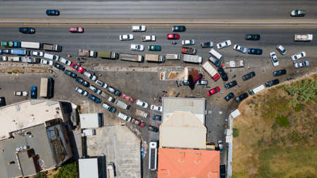 Tens of cars line up near the very few open gas stations in Lebanon. Drivers wait for hours due to fuel shortage.のeditorial素材