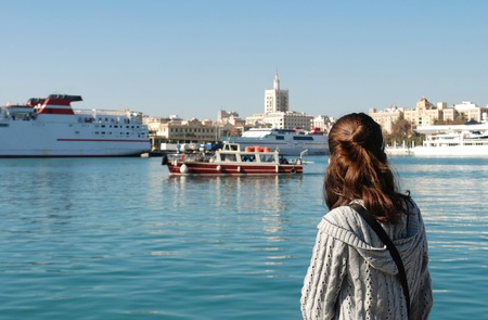 Girl looking at the seaの写真素材