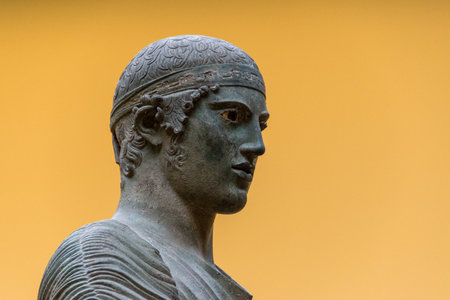 Statue of buddha on yellow background, Bangkok, Thailand