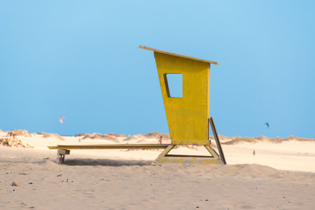 Yellow lifeguard body on the beach with blue sky and sea background.の写真素材
