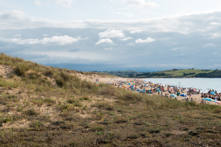 A view of the beach on the sand dunes in Cantabria, Spainの写真素材