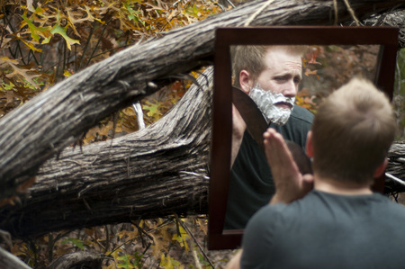 Man Shaving in the Woods With Macheteの写真素材