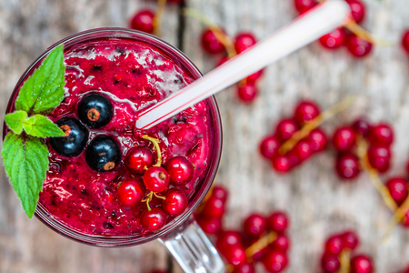 Healthy smoothie from fruits with yogurt. Blended berry of blackcurrant vitamin drink, summer desserts conceptの写真素材