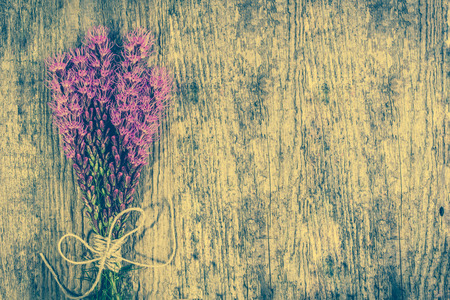 Bouquet of flowers on wood, vintage photoの写真素材