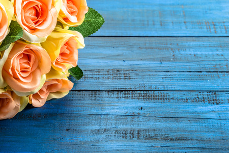 Valentine roses flowers on blue wood background useful as valentine card.の写真素材