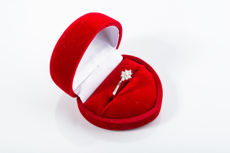 Engagement ring in a box shaped heart.の写真素材