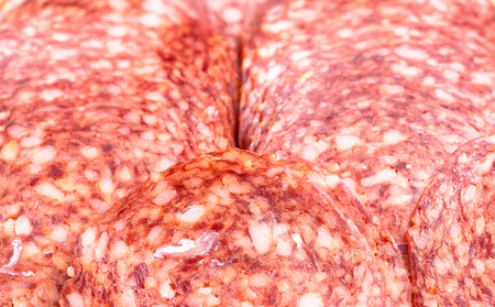 Background, texture of salami slices, selective focus.の写真素材