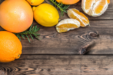 Citrus fruits on wooden table, selective focus.の写真素材